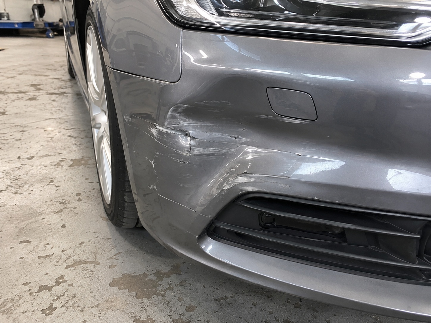 Scuffed car bumper before repair at AS No1 Body Work