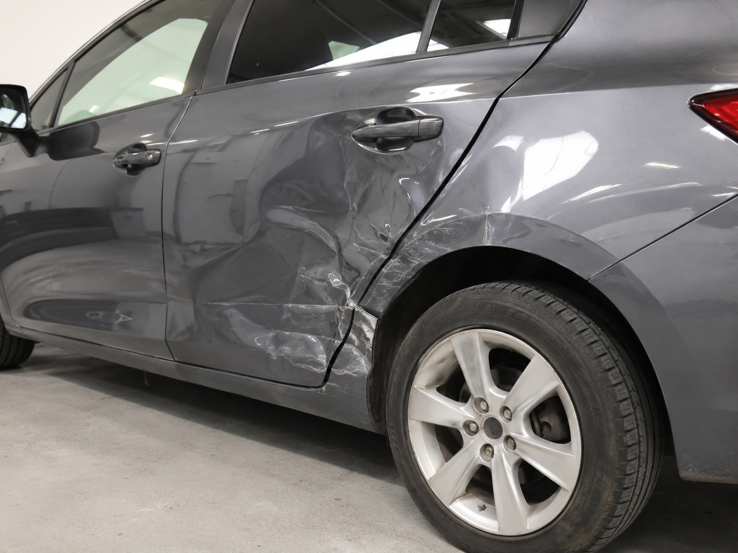 Car panel with a dent before repair at AS No1 Body Work